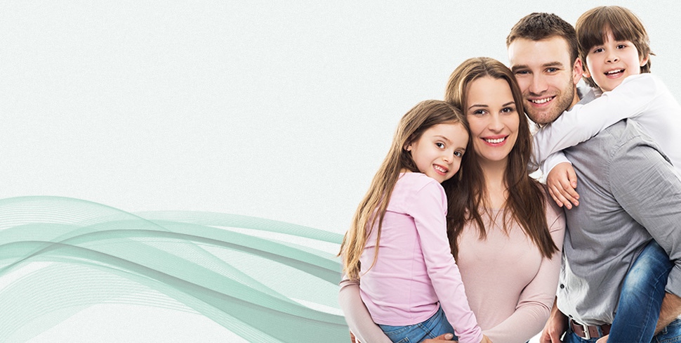 Family with a boy and a girl smiling with bright white teeth